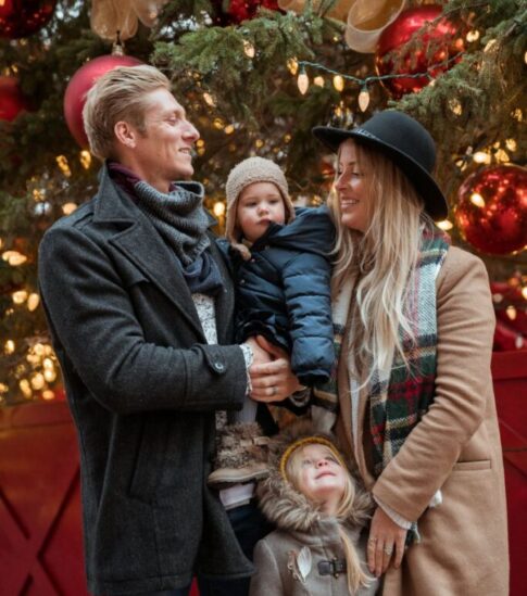 family-in-front-of-christmas-tree